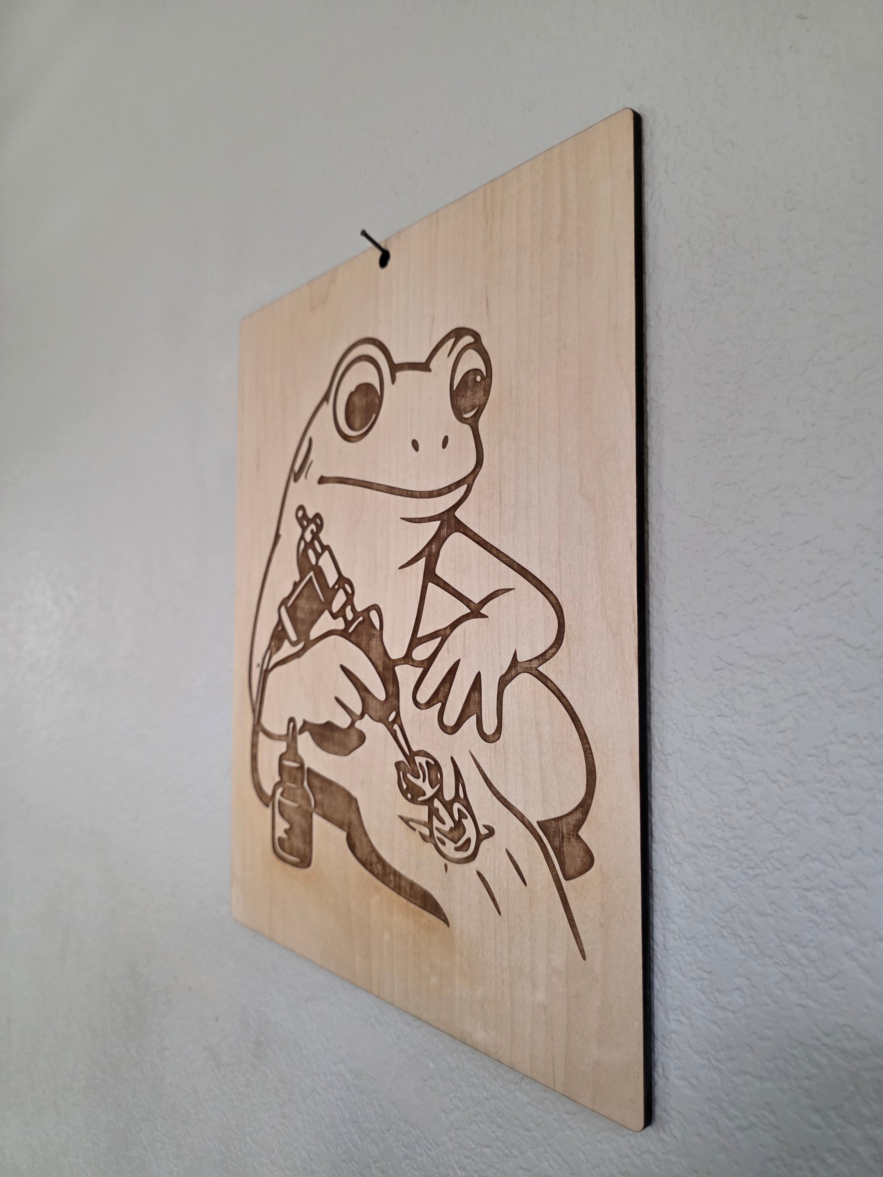 Tattoo Artist Frog – 11" x 17" Engraved Maple Wall Art