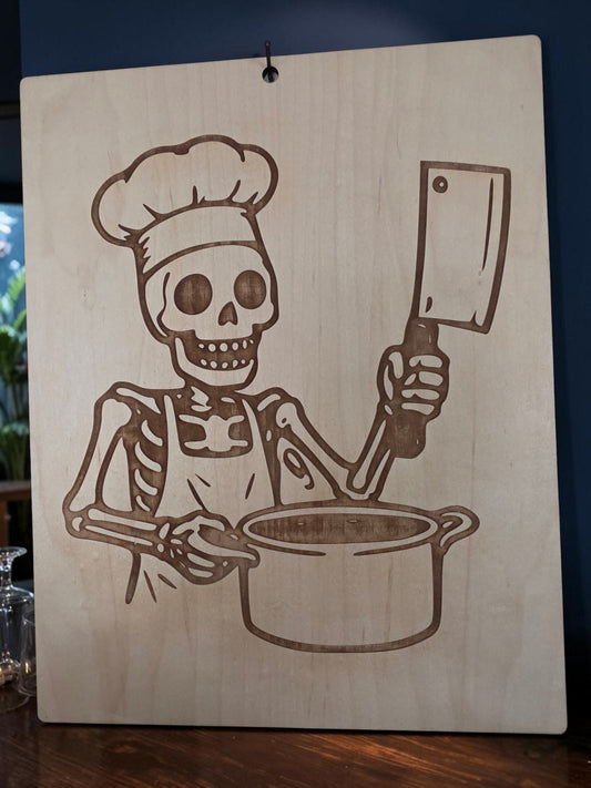 Skeleton Chef with Cleaver – 11" x 17" Engraved Maple Kitchen Wall Art