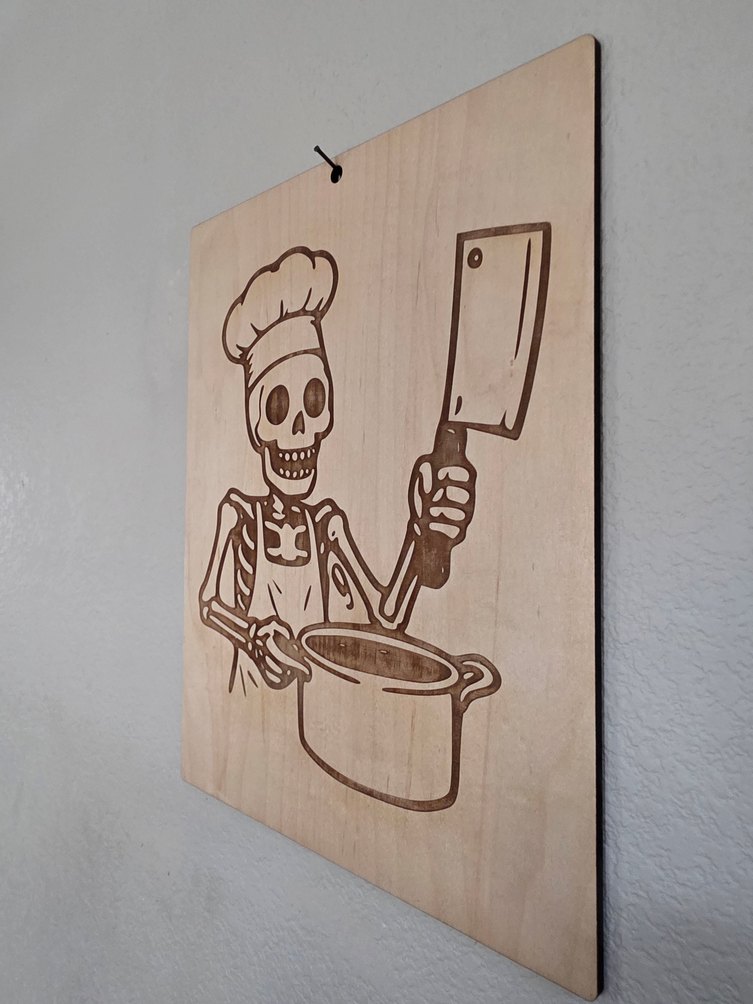 Skeleton Chef with Cleaver – 11" x 17" Engraved Maple Kitchen Wall Art