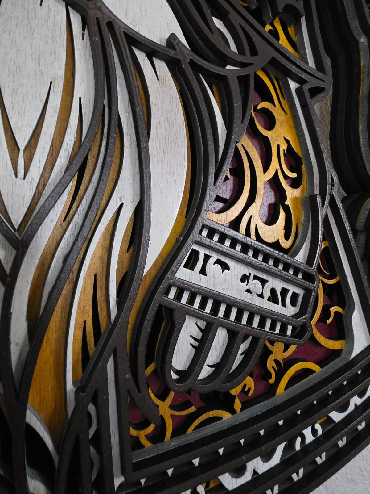 Close-up detail of layered Christmas gnome beard, patterned coat, and dimensional wood craftsmanship