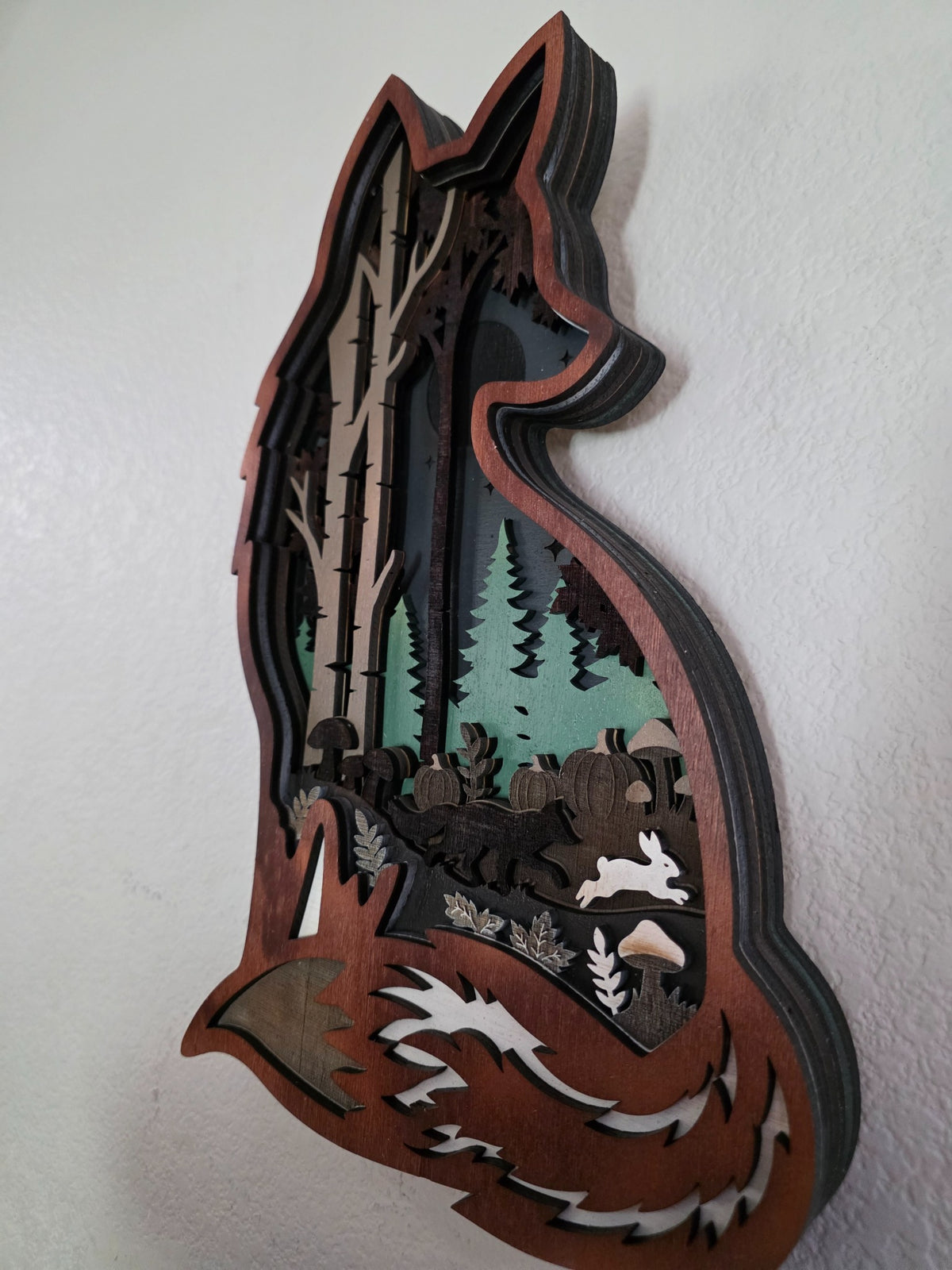Side view of layered wooden fox woodland wall art showing deep layered construction